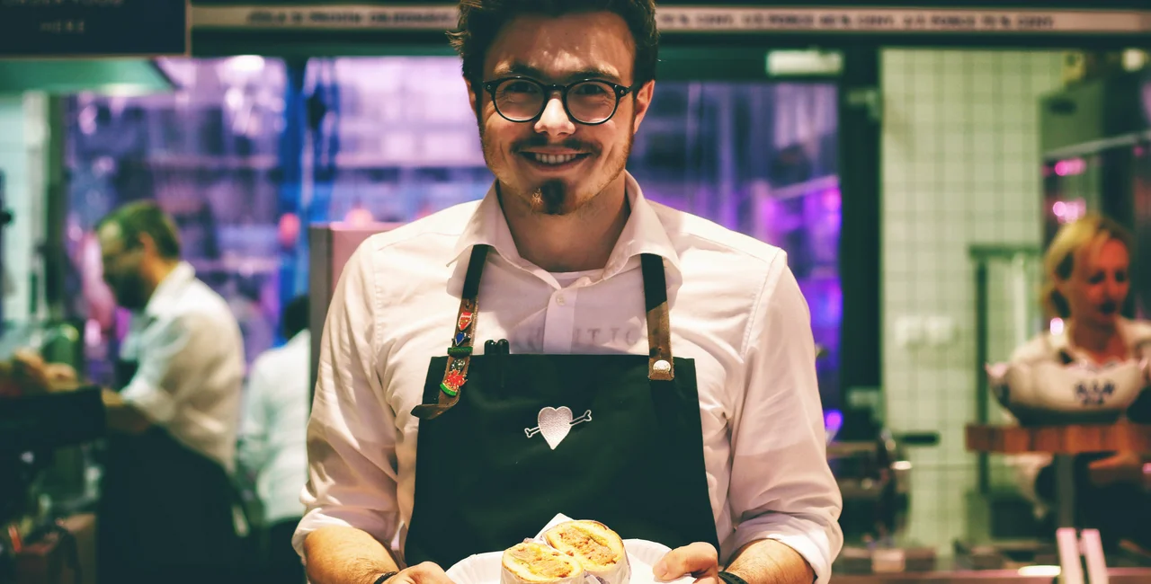 A waiter in Prague - photo via Petr Sevcovic on Unsplash